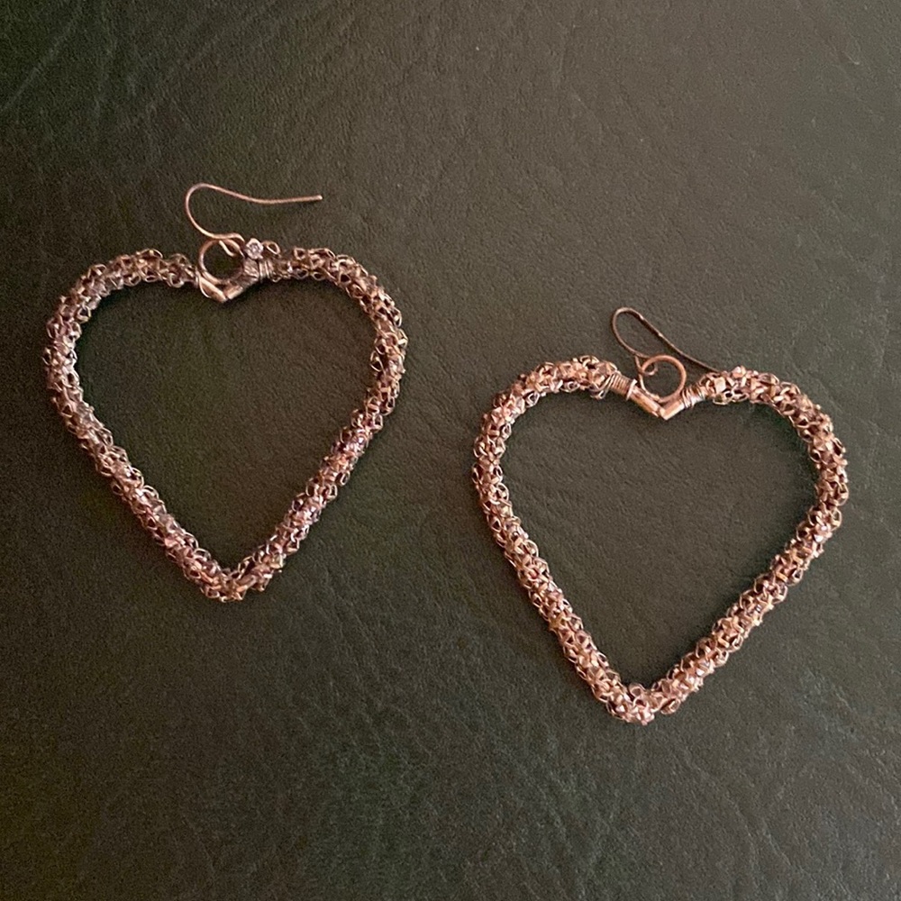 Silver heart shaped dangle earrings
